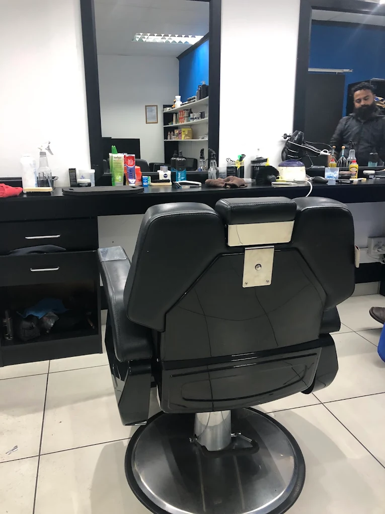 Barber chair at a station stocked with grooming products